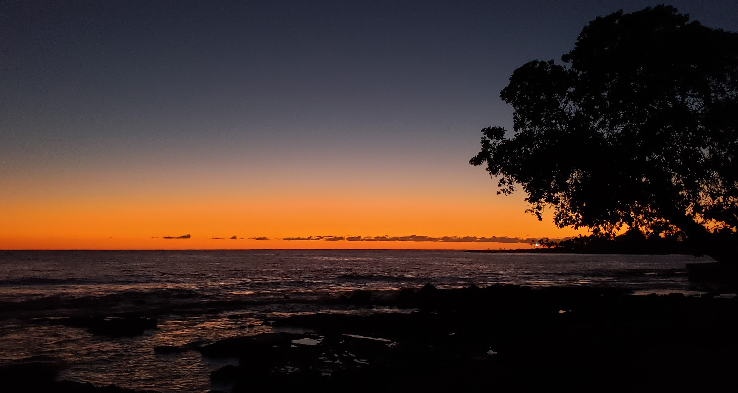 sunset over the beach on the island of Hawai'i